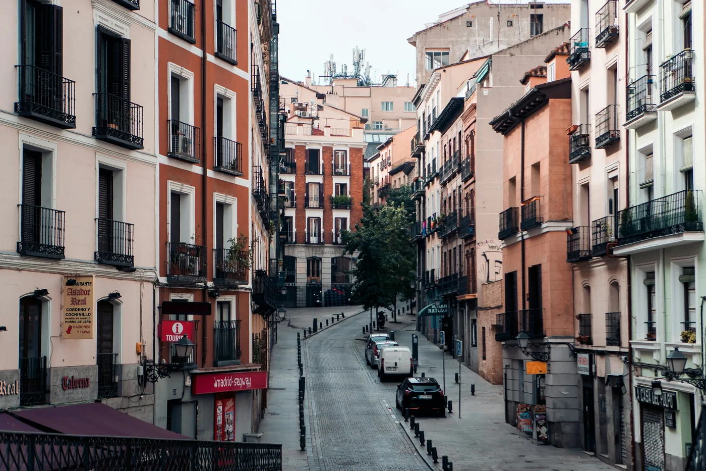 A lamp-lit plaza in central Madrid, Spain, in the evening
